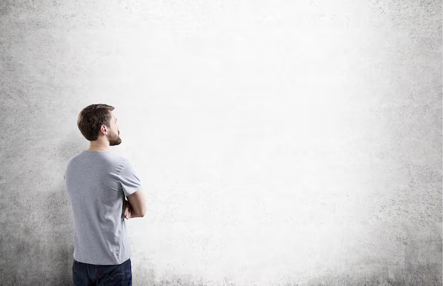 A man staring at a wall