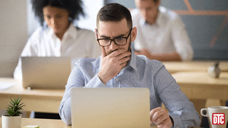Student looking stressed at a laptop