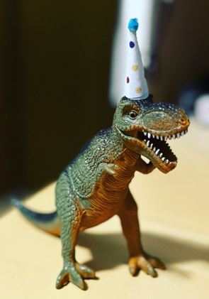 A dinosaur wearing a hat