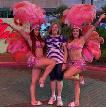 Morgan posing with dancers
