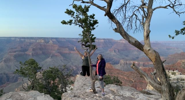 Morgan and her mom standing in front of a mountain view