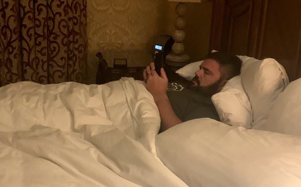 Morgan's husband laying down on a bed