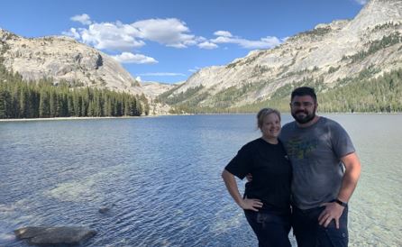 Morgan with her husband, with a lake view